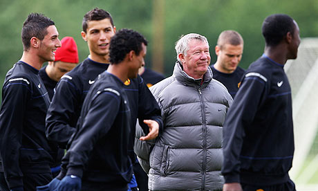 Sir Alex Ferguson and his players during training